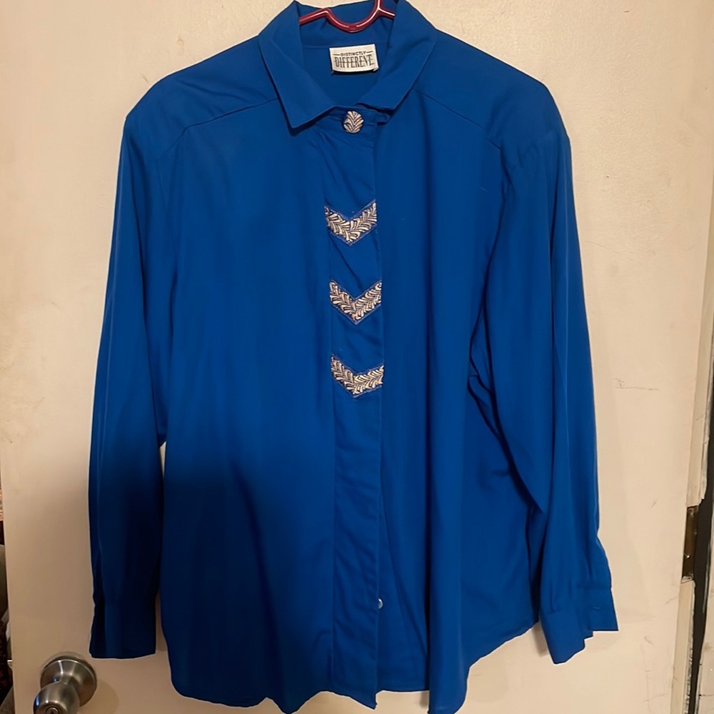 Woman’s distinctly different blue with silver buttons button down long sleeve to